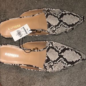 Express snake skin mules.